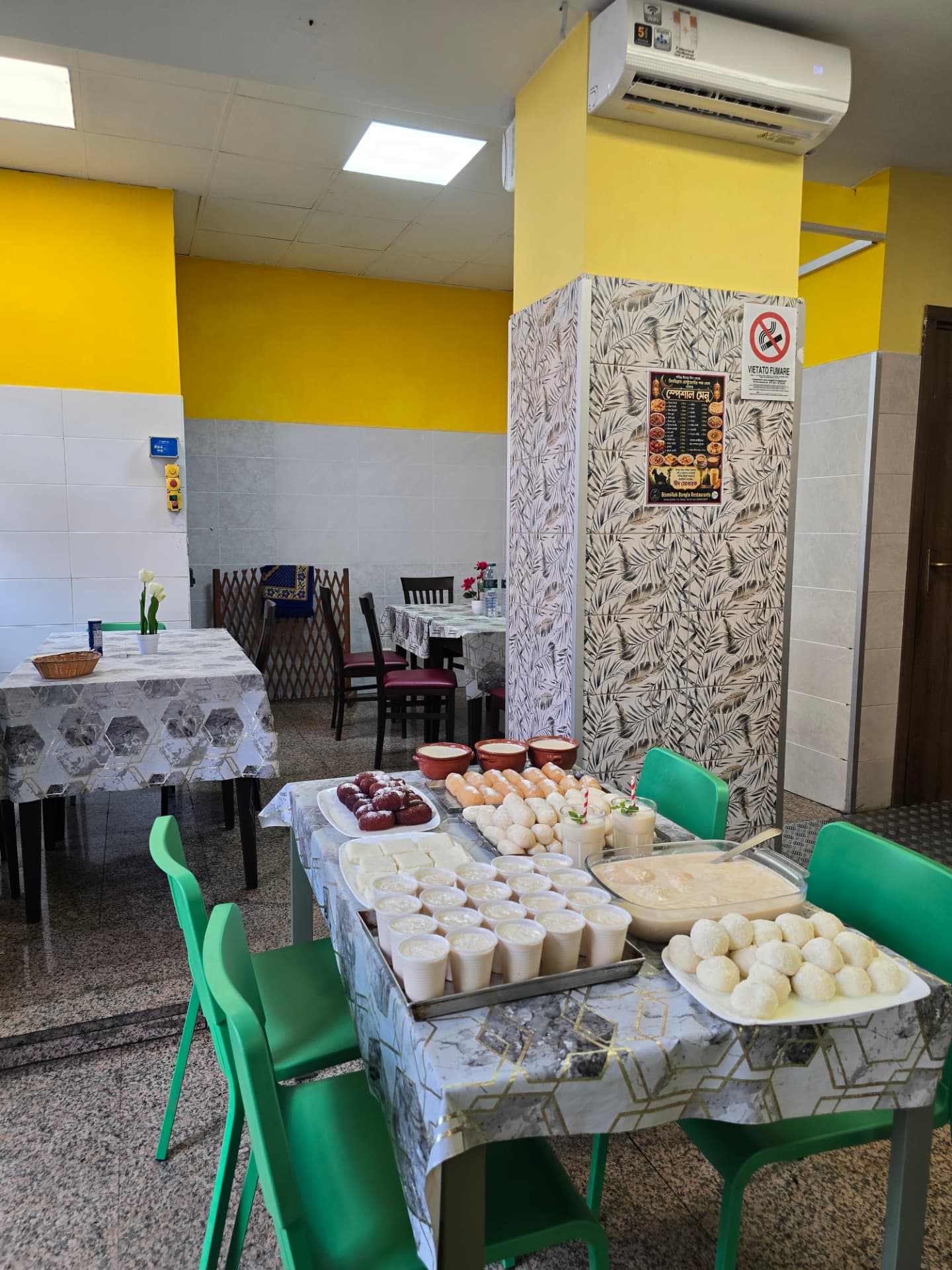Bismillah Bangla Restaurant — dining room with trays of fresh Bengali sweets and lassi