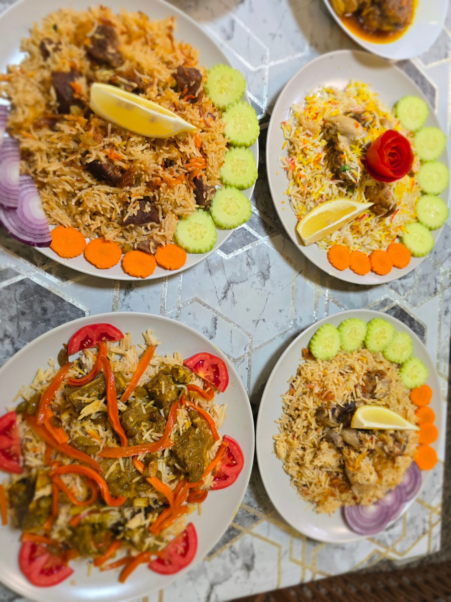 Bismillah Bangla Restaurant — four plates of mutton and chicken biryani with salad