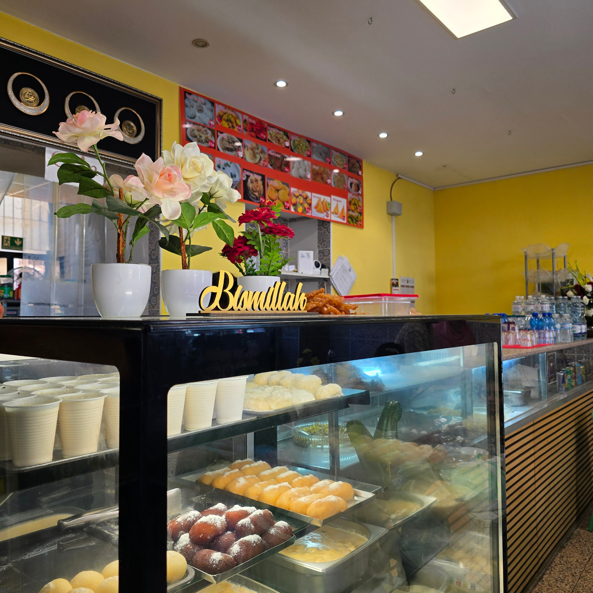 Bismillah Bangla Restaurant — sweet counter display with mishti and desserts