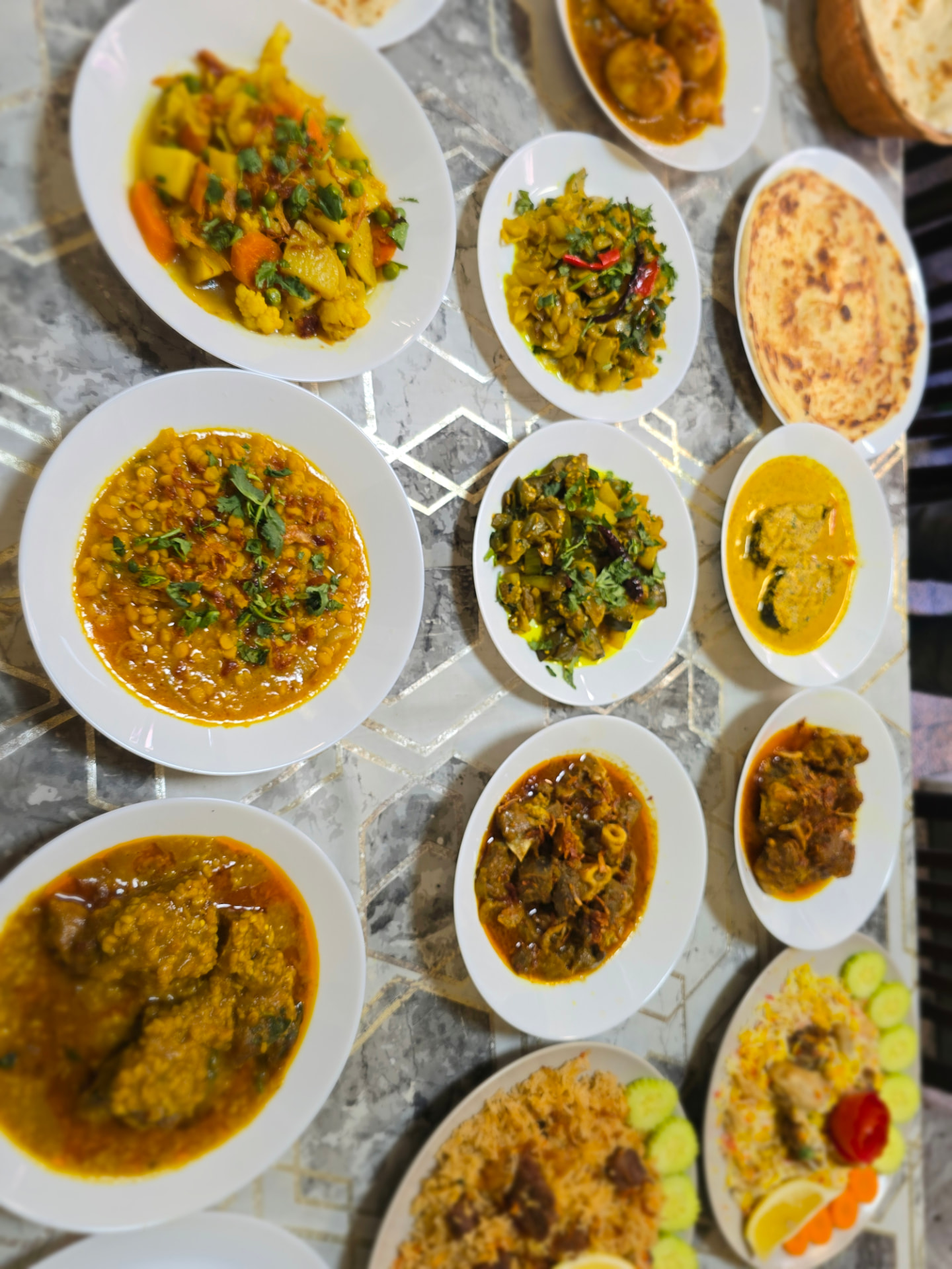 Bismillah Bangla Restaurant — spread of curries, dal, vegetables and paratha
