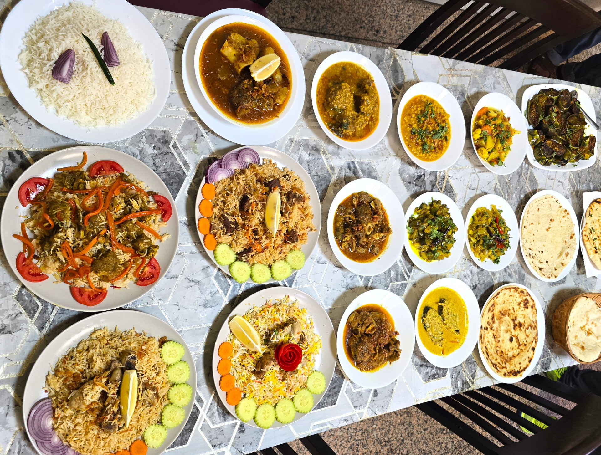 Bismillah Bangla Restaurant — full table spread of biryani, curries, dal and breads